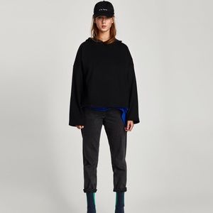 Black cropped hoodie with bell sleeves